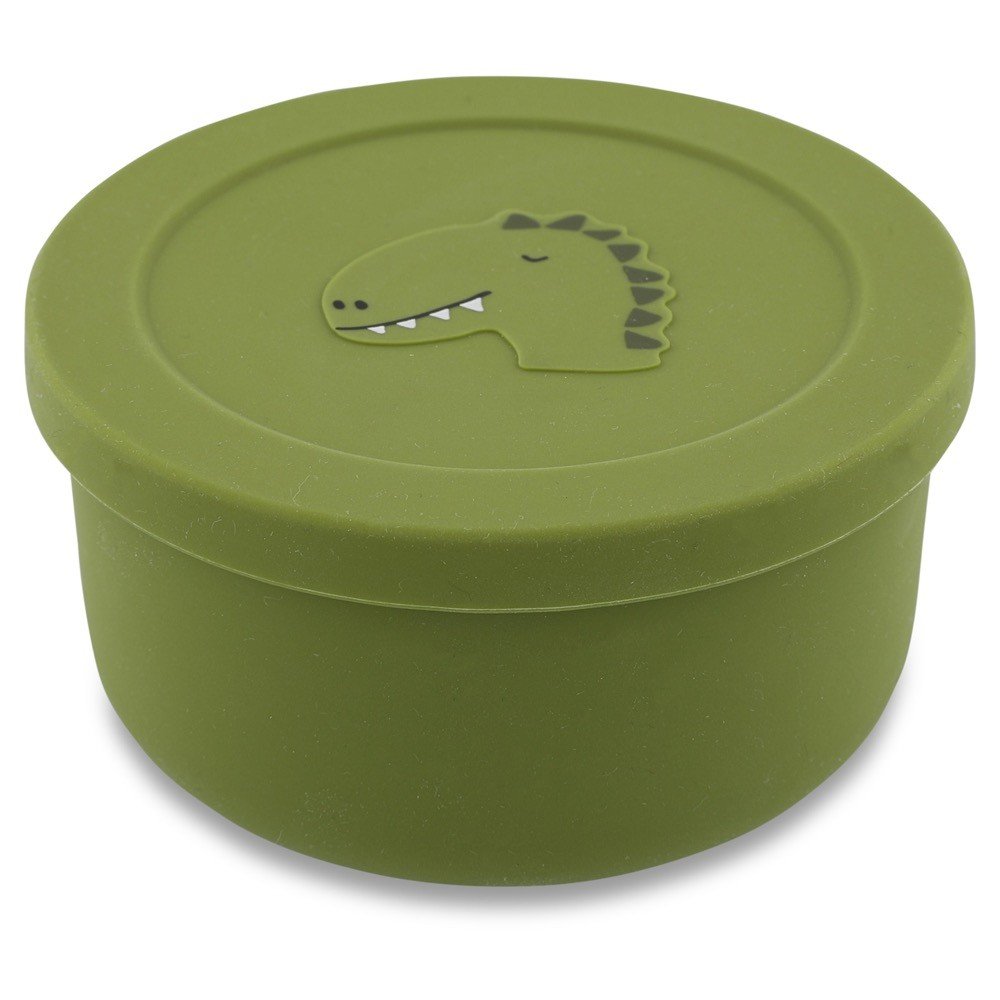 1. Green silicone snack container with dinosaur design on lid, by Trixie Baby, shown in studio setting