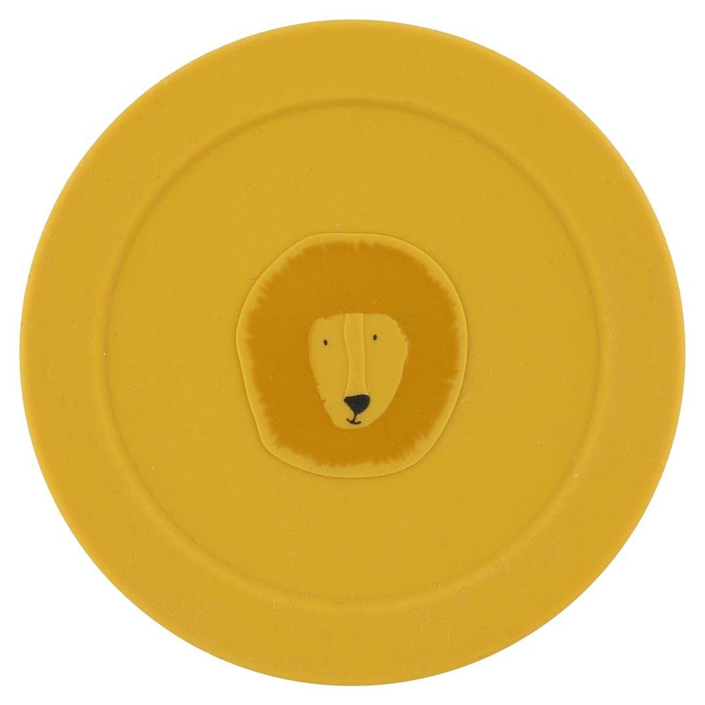3. Top view of yellow silicone lid with Mr. Lion face, part of Trixie Baby snack container