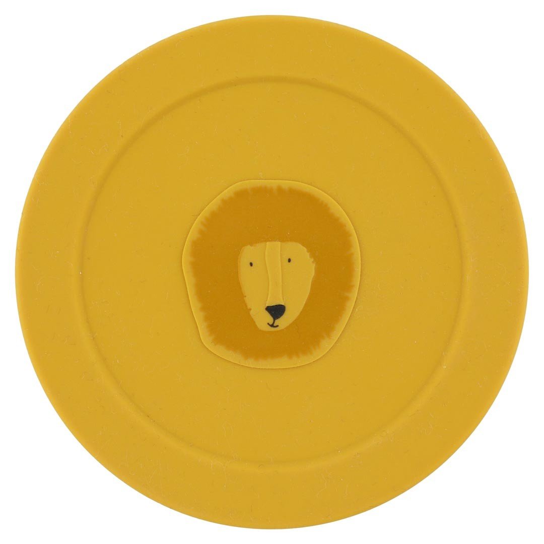 3. Top view of yellow silicone lid with Mr. Lion face, part of Trixie Baby snack container