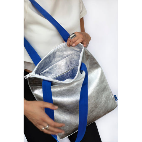 4. Close-up of Daz Studio silver leather tote interior with blue leather pocket and white zipper