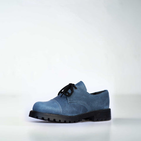 4. Angled view of Samelin Blue Widgets unisex sneakers in blue, emphasizing leather upper and sturdy construction