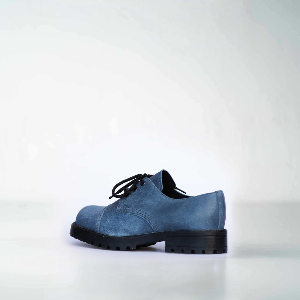 2. Side view of Samelin Blue Widgets unisex sneakers in blue leather with black laces, highlighting rugged design