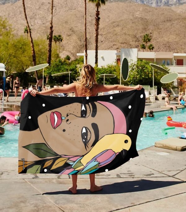 2. Women's black Towel Siuzana by Garbanota with artistic design, displayed poolside