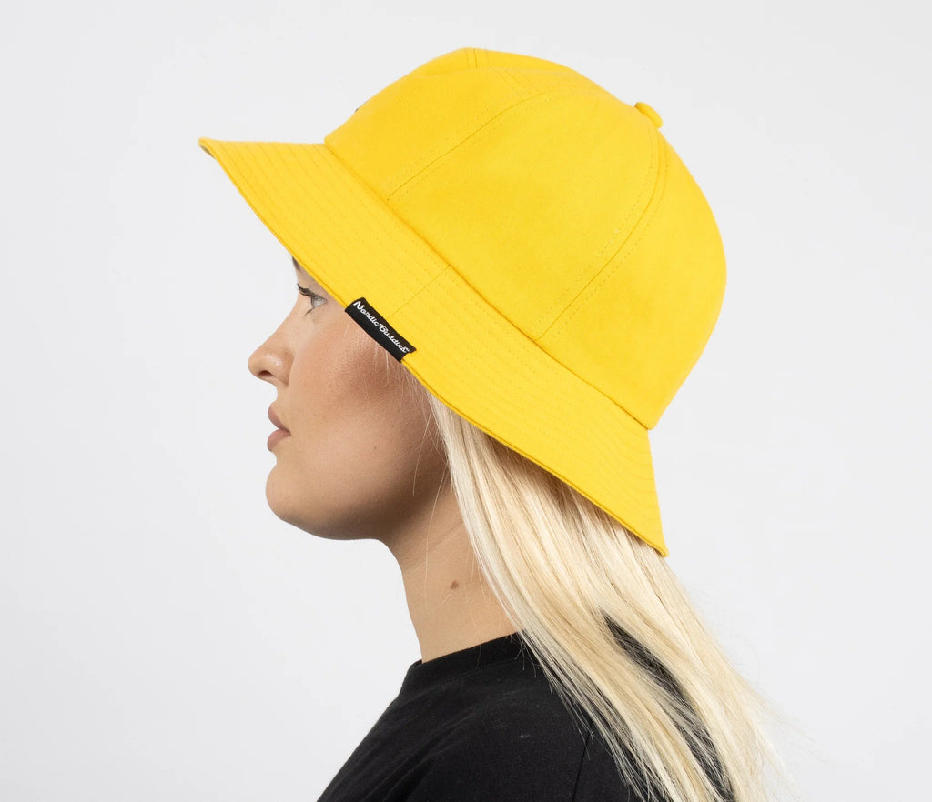 2. Side view of women's yellow Stinky Bucket Hat by Moomin, worn by model