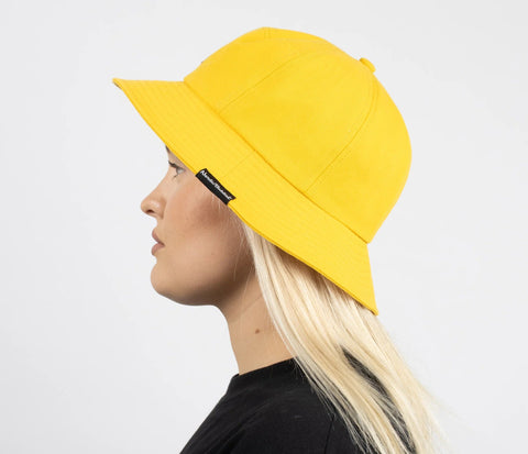 2. Side view of women's yellow Stinky Bucket Hat by Moomin, worn by model
