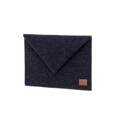 4. Side view of Nordhale Skive black clutch and laptop case in studio setting