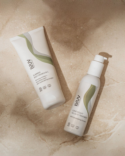 4. LUUV Slimming Body Cream and Curve Sculpt Cellulite Treatment on marble surface, showcasing product design