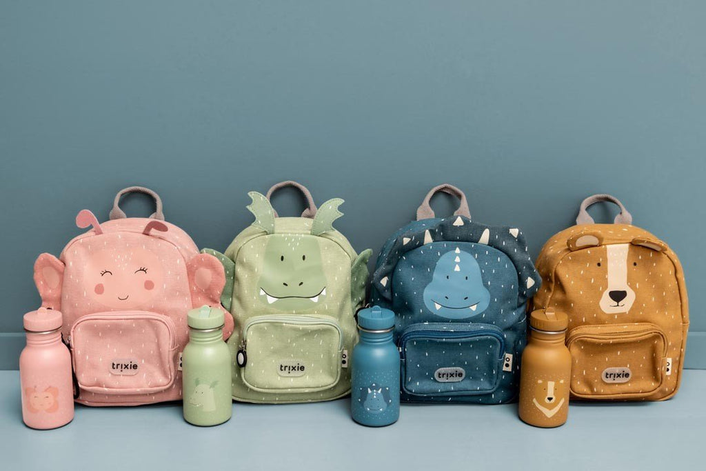 8. Collection of four colorful animal-themed backpacks with matching bottles on blue background