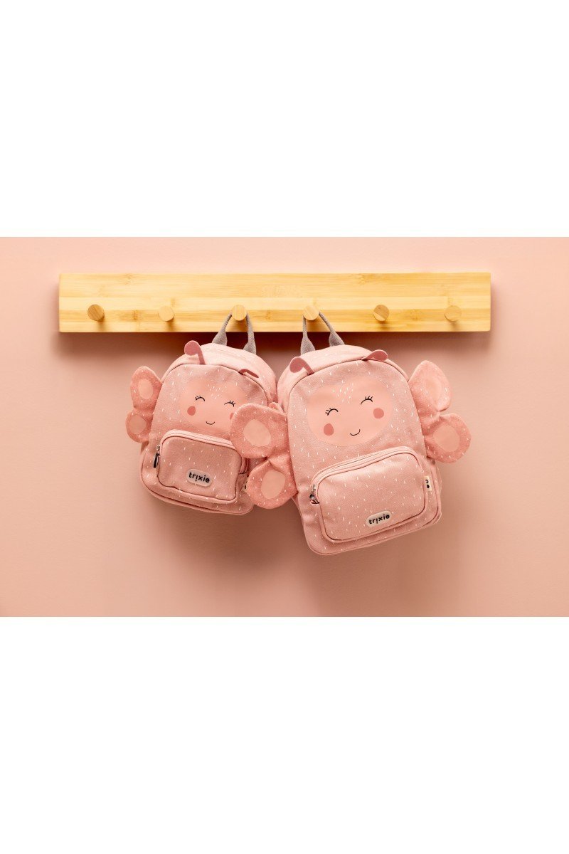1. Two pink Trixie Baby Mrs. Butterfly backpacks hanging on a wooden rack