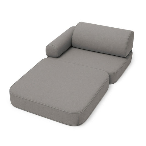 2. Clay taupe children's sofa arranged as a lounger with armrest and backrest on white background