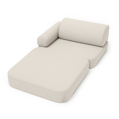 2. Beige children's sofa arranged as a lounger with armrest on white background