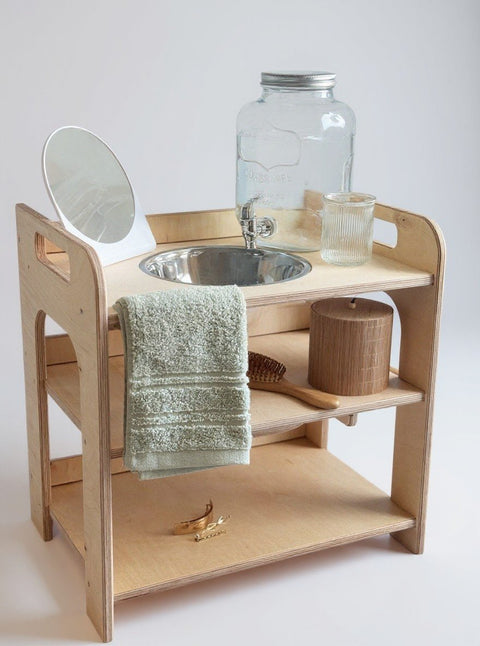 2. Montessori wash station with enamel bowl and towel on white background
