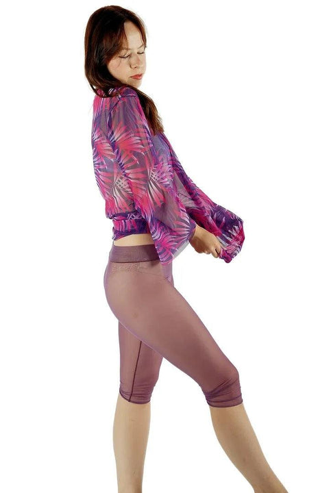 2. Side view of women's Tan-Through Tunic in Pink Tropics by Smarttan, showing stretchy fit