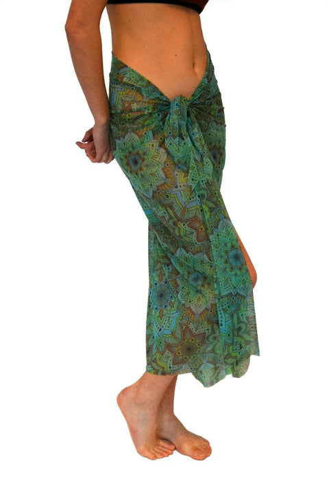 1. Women's green mandala tan-through sarong by Smarttan, shown in lifestyle setting, highlighting ultra-thin mesh material and vibrant print