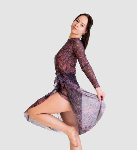 2. Female model posing in Smarttan Terracotta Mandala Tan Through Sarong, highlighting breathable fabric and stylish pattern