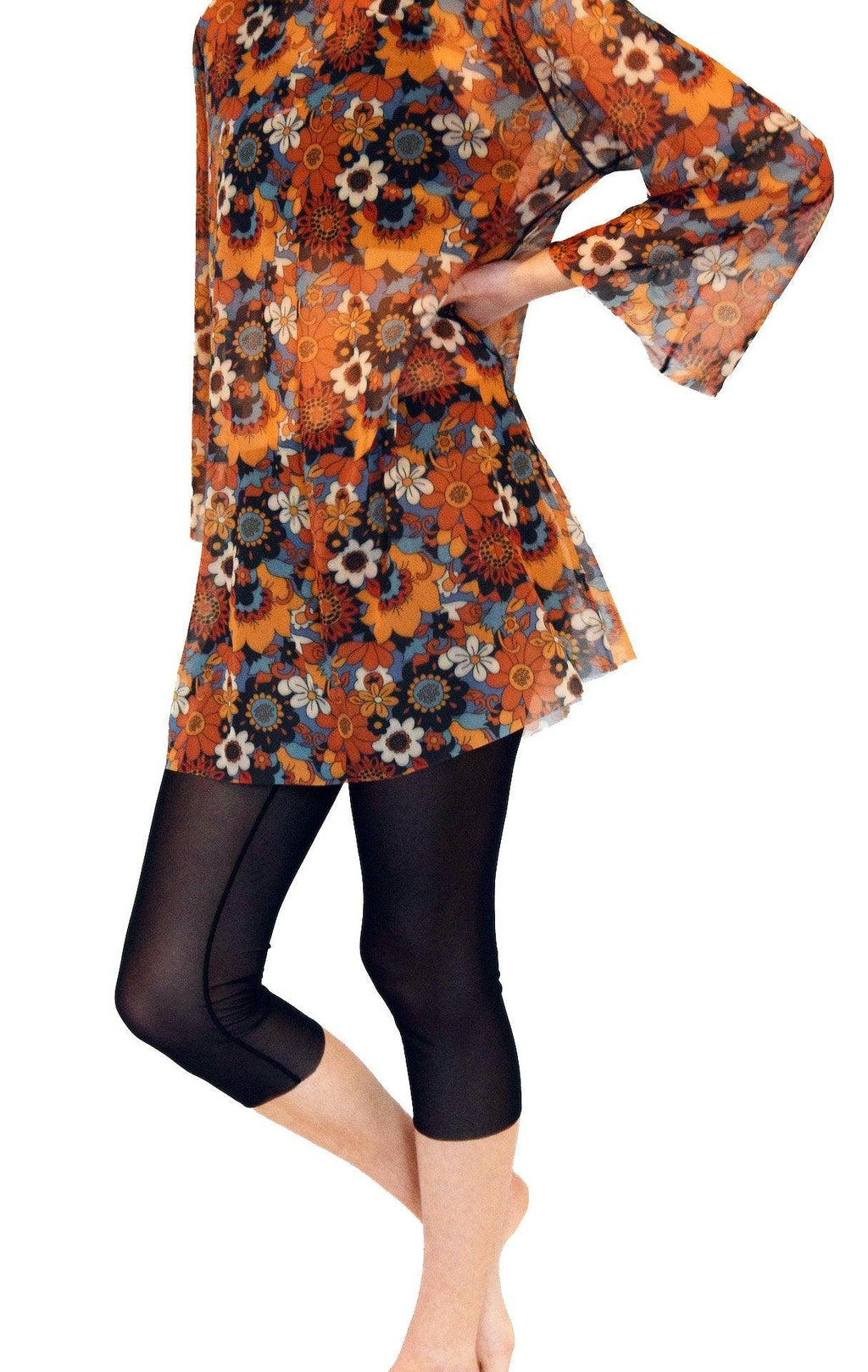 1. Women's Smarttan tan-through black leggings styled with floral tunic, perfect for sun exposure