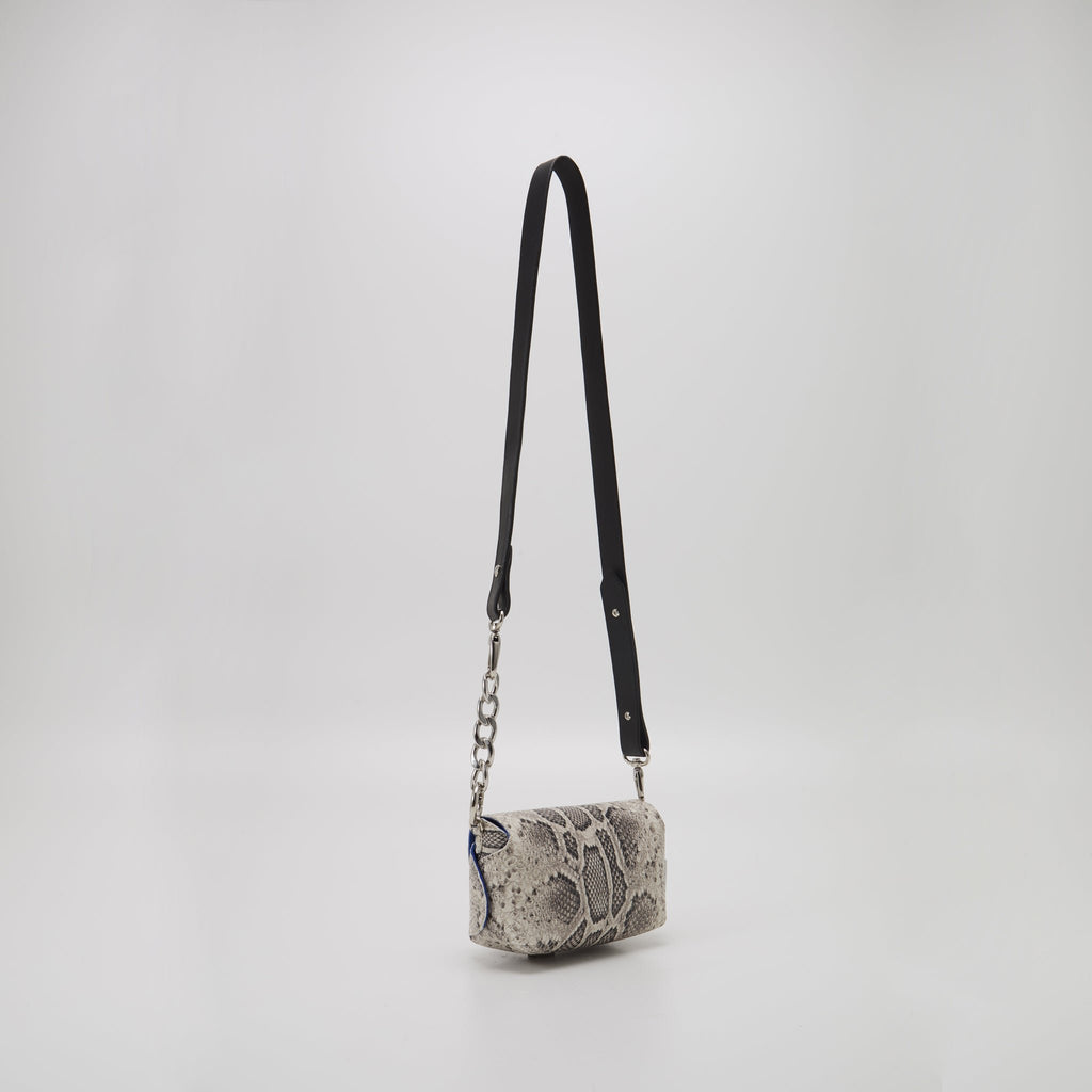 3. Studio shot of Daz Studio handmade leather shoulder bag in snake print with adjustable strap