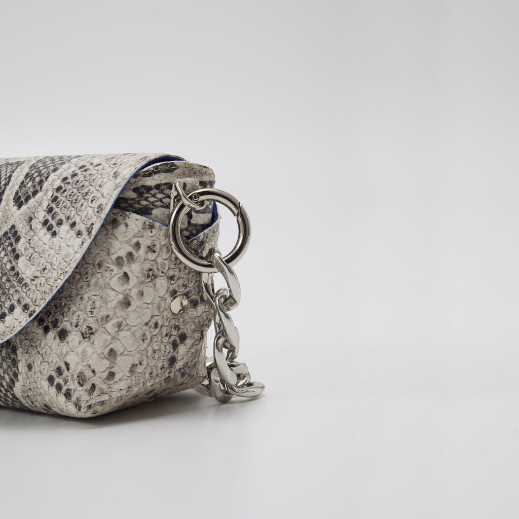 7. Detail of Daz Studio snake print leather bag showing silver hardware and chain strap