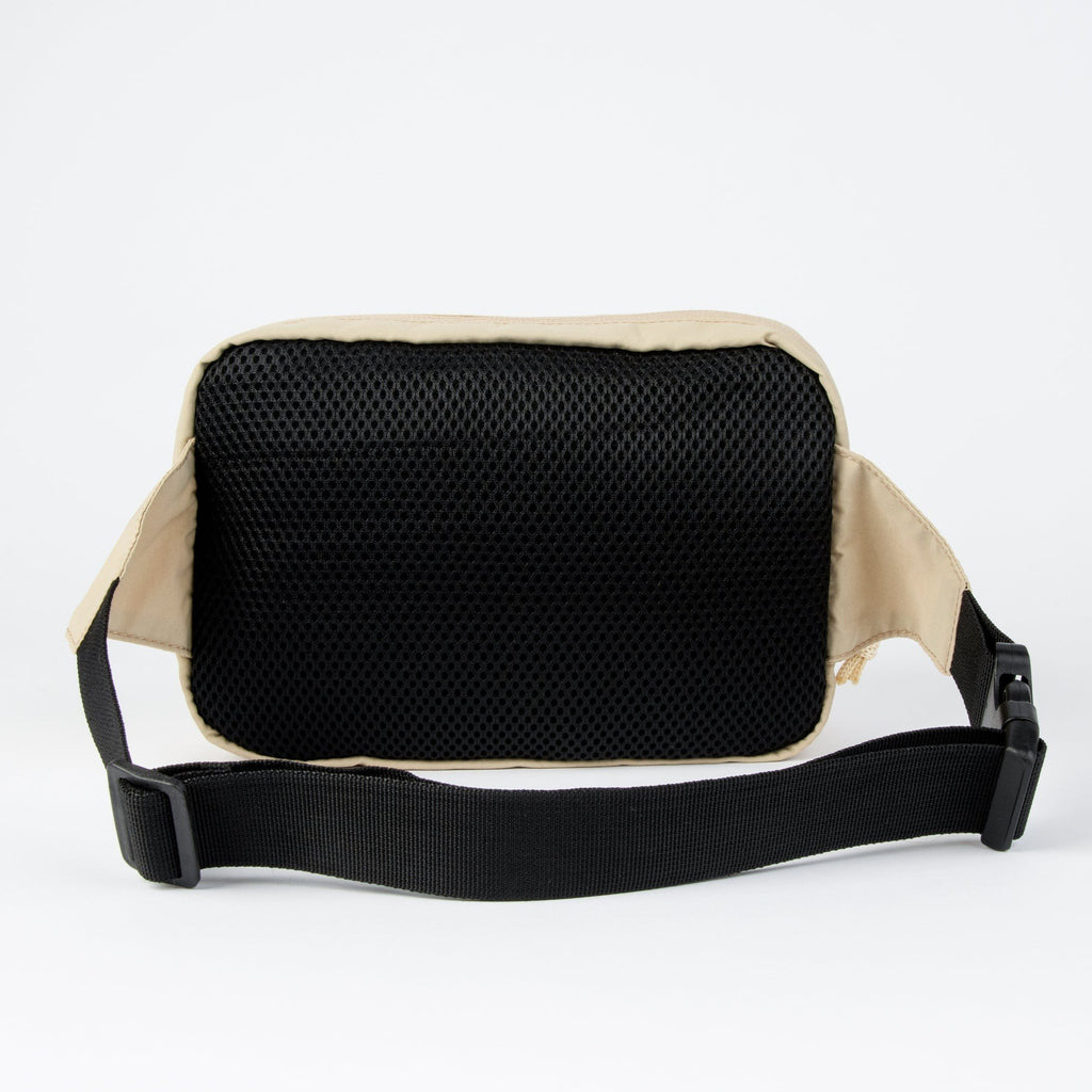2. Back view of beige Sniff Retro Waist Bag with black mesh padding and strap, studio background