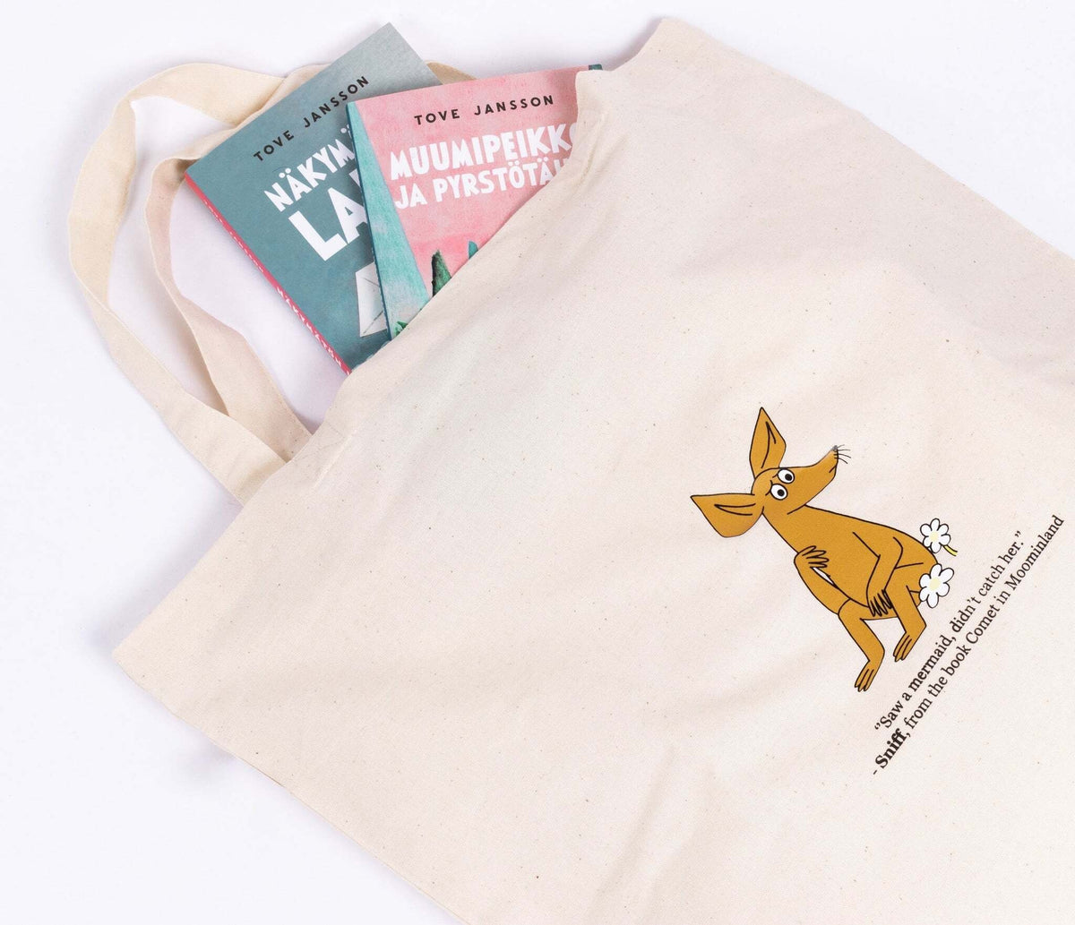 3. Close-up of beige Sniff Tote Bag with books inside, highlighting Sniff character design