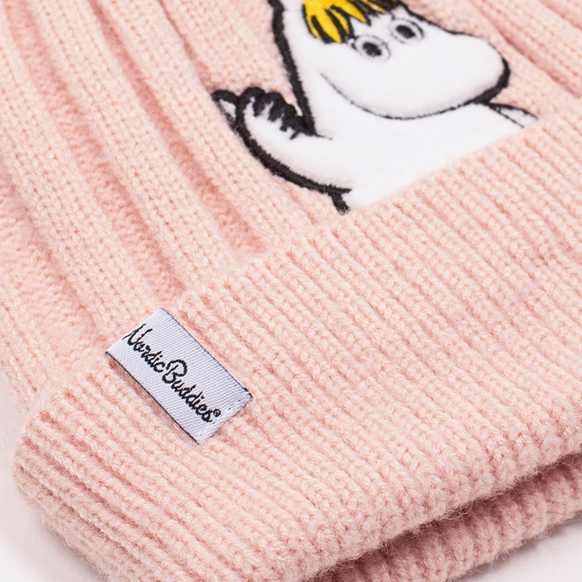 2. Close-up of NordicBuddies label on pink beanie with Snorkmaiden embroidery
