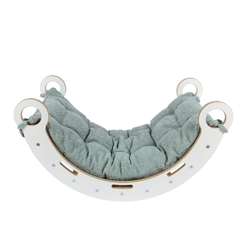 3. Front view of Snug Rocker for kids with fresh mint pillow, emphasizing rounded edges and handles
