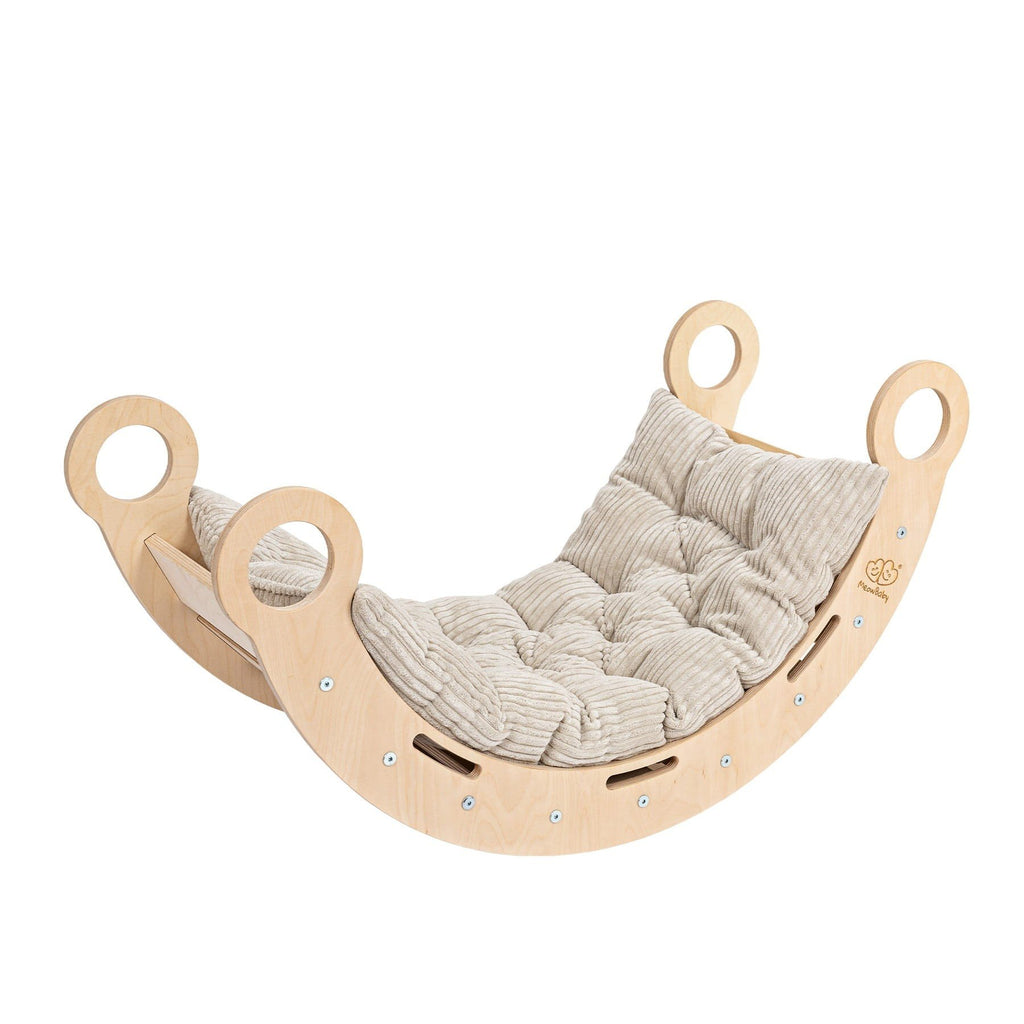 1. Snug Rocker for kids in natural birch plywood with beige cushioned pillow, angled view highlighting rounded handles