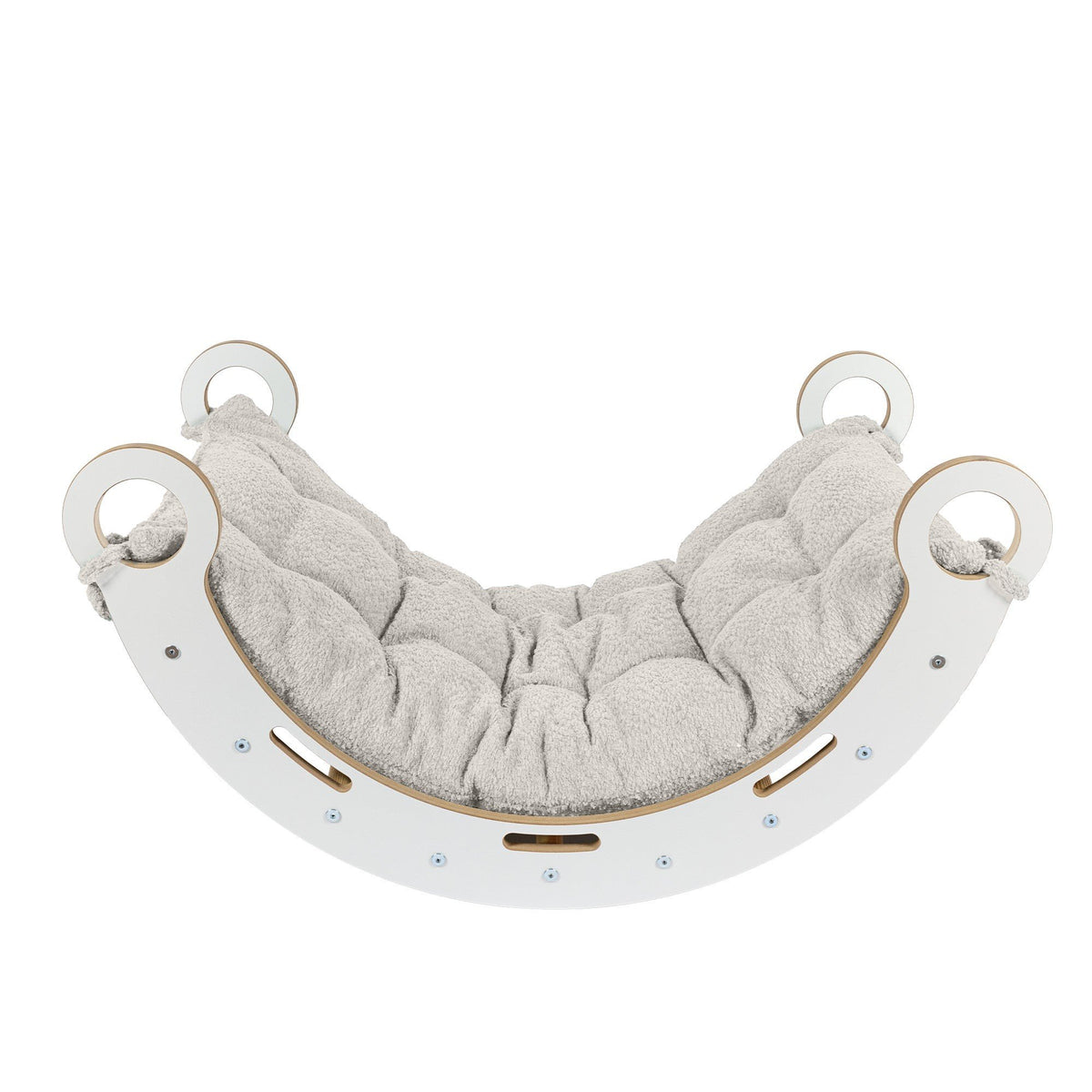 2. Front view of Snug Rocker for kids with ecru pillow, showcasing the rounded edges and stable design