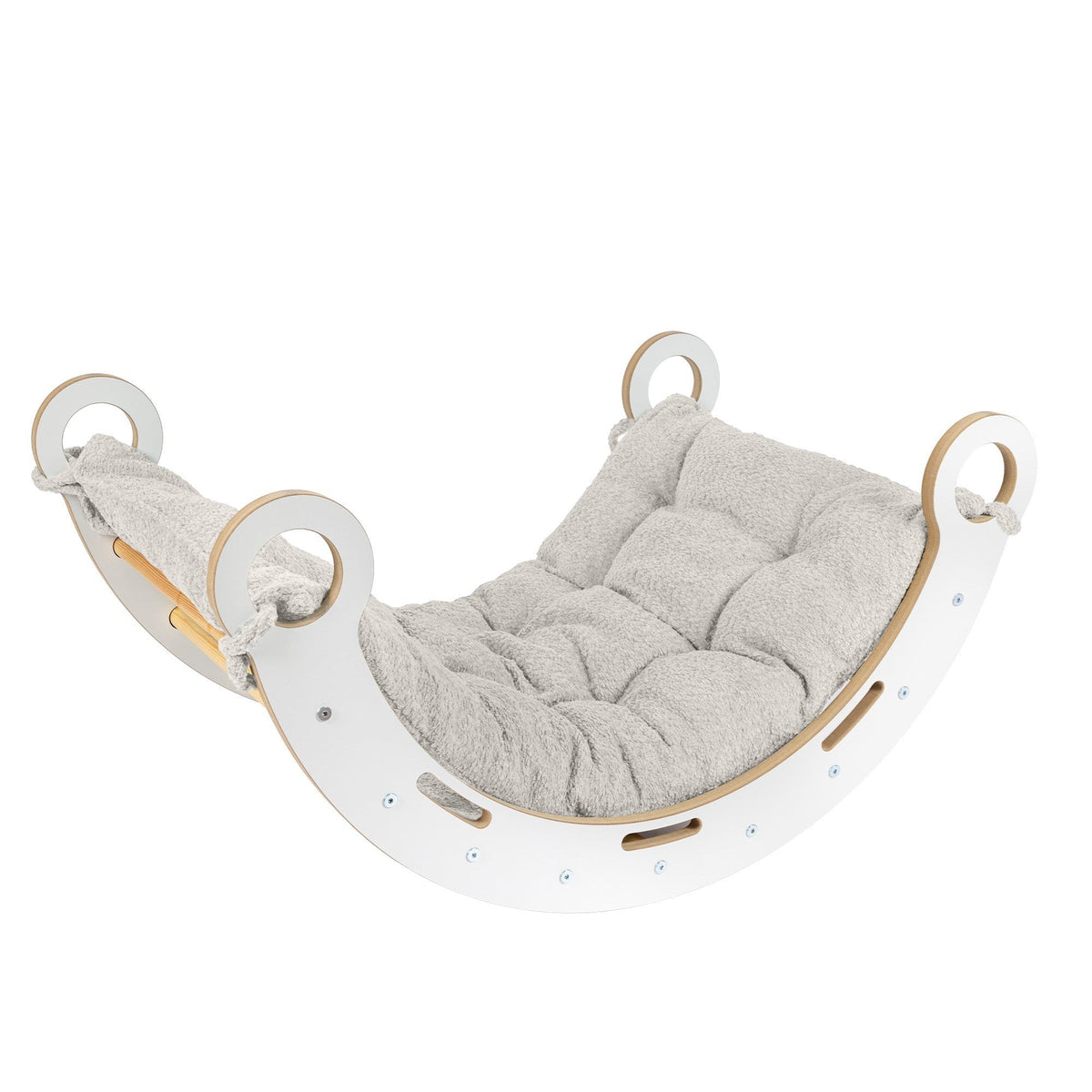 1. Snug Rocker for kids with ecru pillow, featuring smooth birch plywood and rounded edges, shown in a studio setting