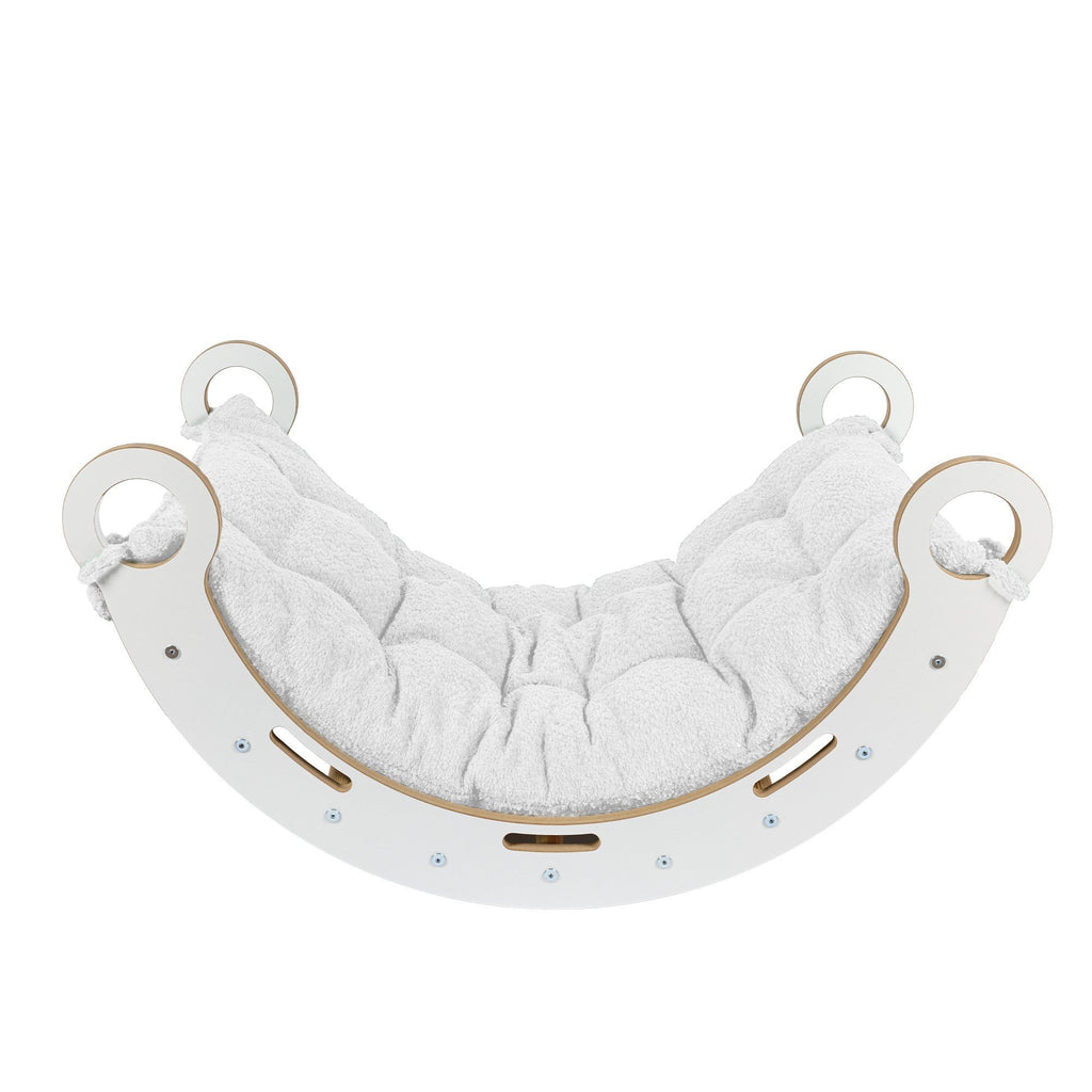 3. Side view of Snug Rocker for kids with white pillow, highlighting rounded edges and sturdy design