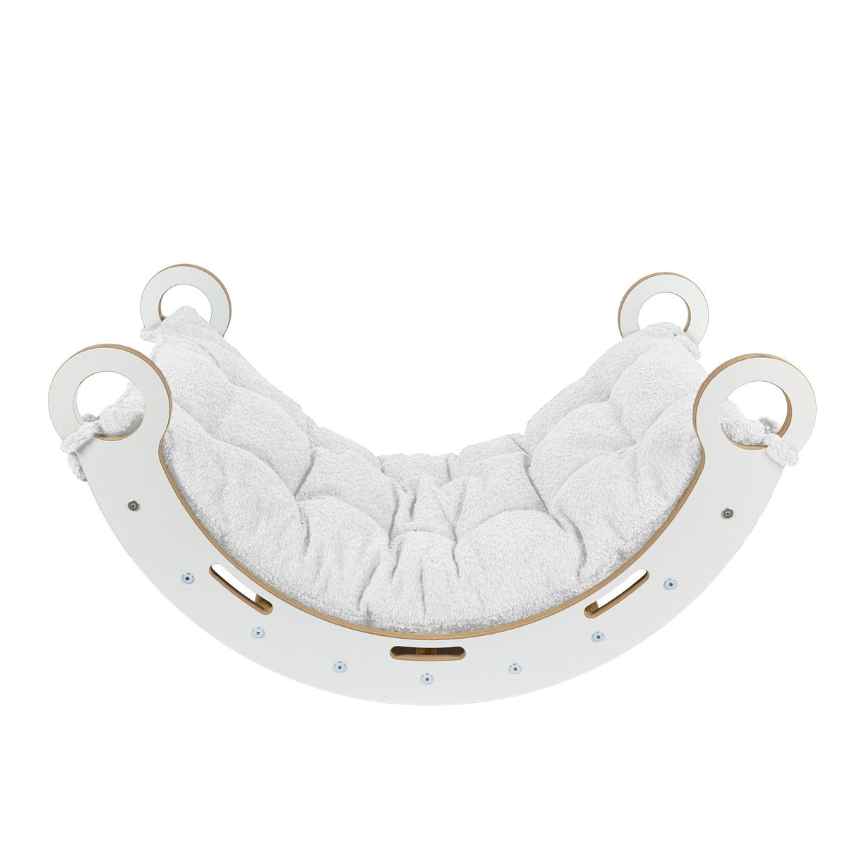 3. Side view of Snug Rocker for kids with white pillow, highlighting rounded edges and sturdy design