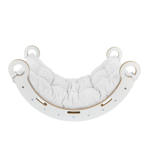 3. Side view of Snug Rocker for kids with white pillow, highlighting rounded edges and sturdy design