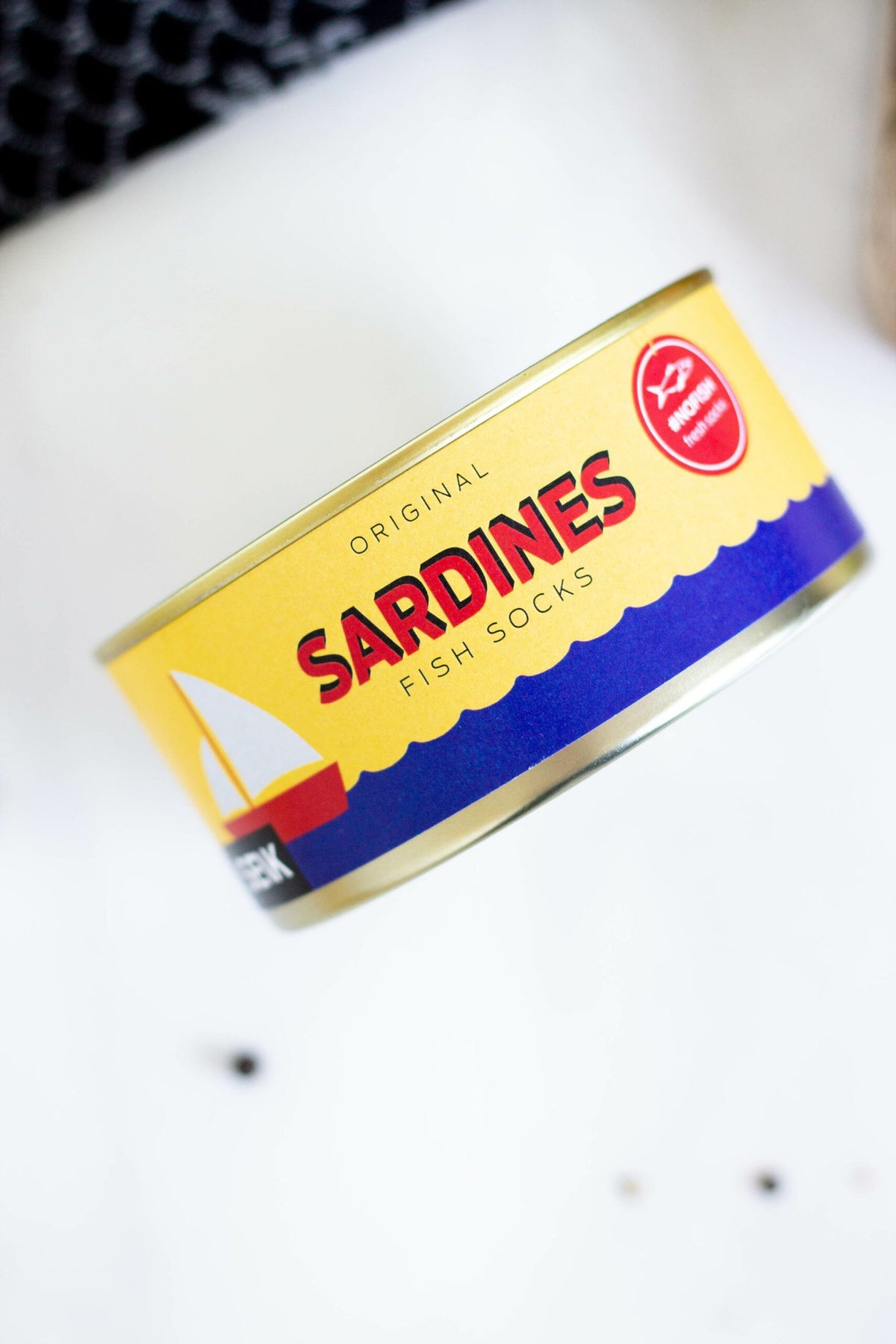 4. Close-up of SEIK Sardines socks packaging, showcasing sardine-inspired design and branding