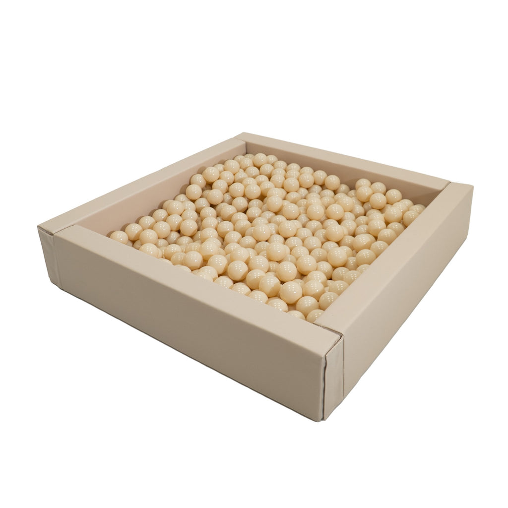 2. Beige IGLU soft play ball pit filled with cream-colored balls on white background