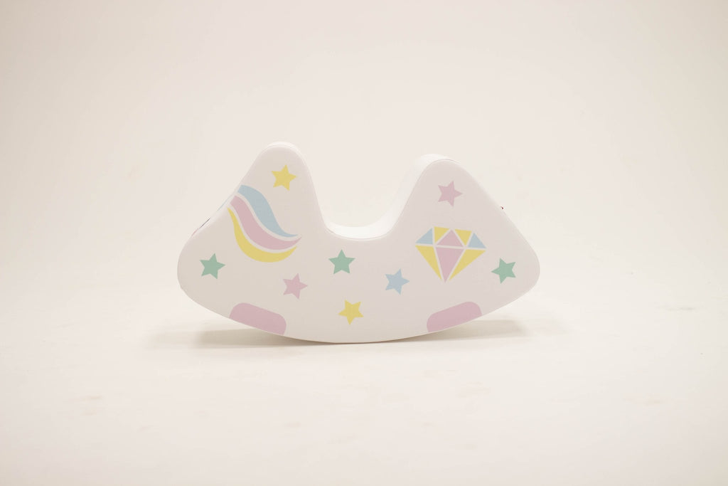 7. Flat lay of IGLU unicorn toy showing side with rainbow and star patterns