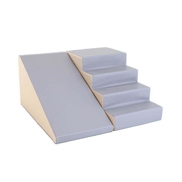 1. Beige and grey soft play step and slide set by IGLU shown in a studio setting