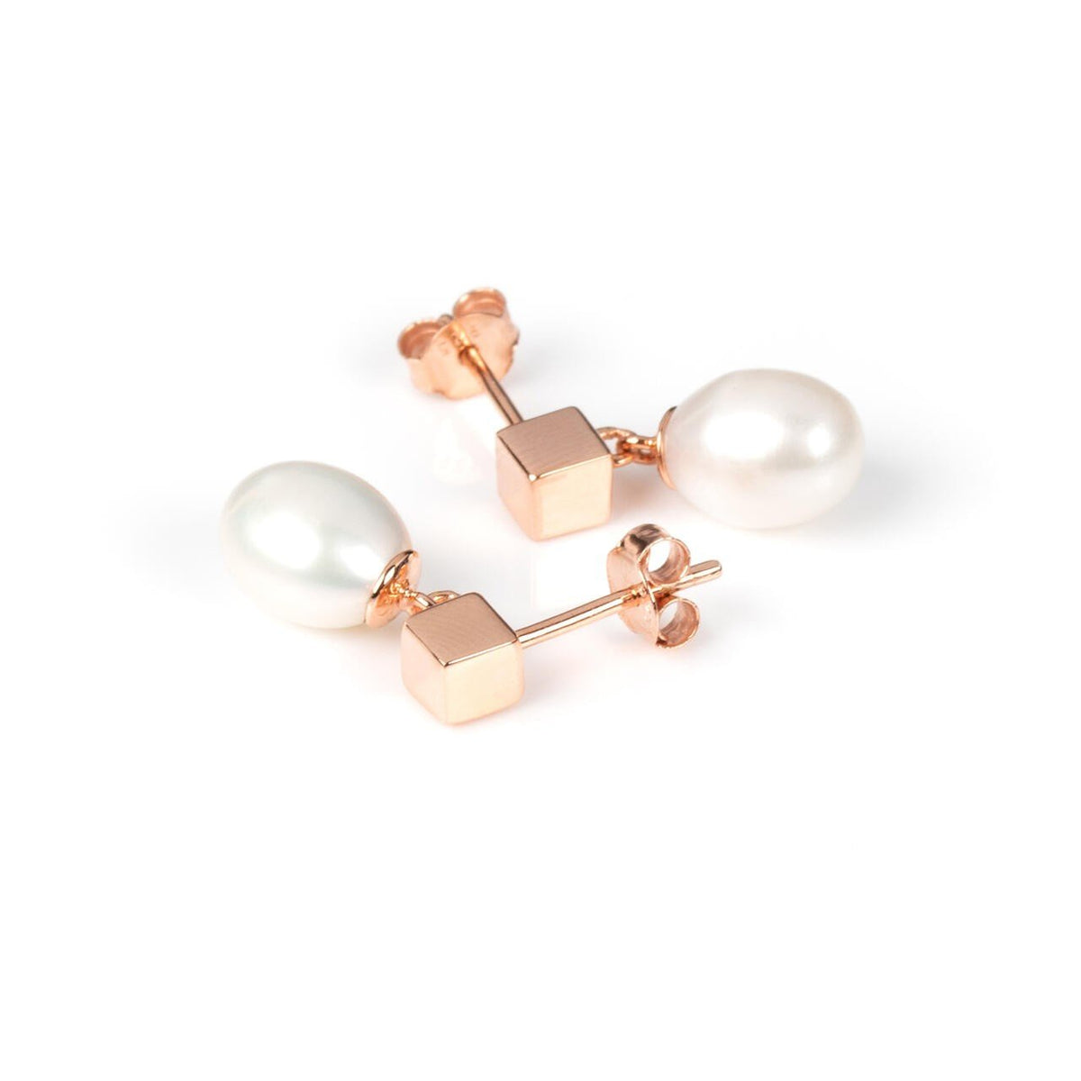 4. Close-up of MyaMoon solid pearl drop earrings in rose gold, showing earring backs and pearl detail