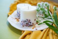 6. Close-up of TL Candles soy wax candles with amber pieces, showcasing pine scent and decorative elements