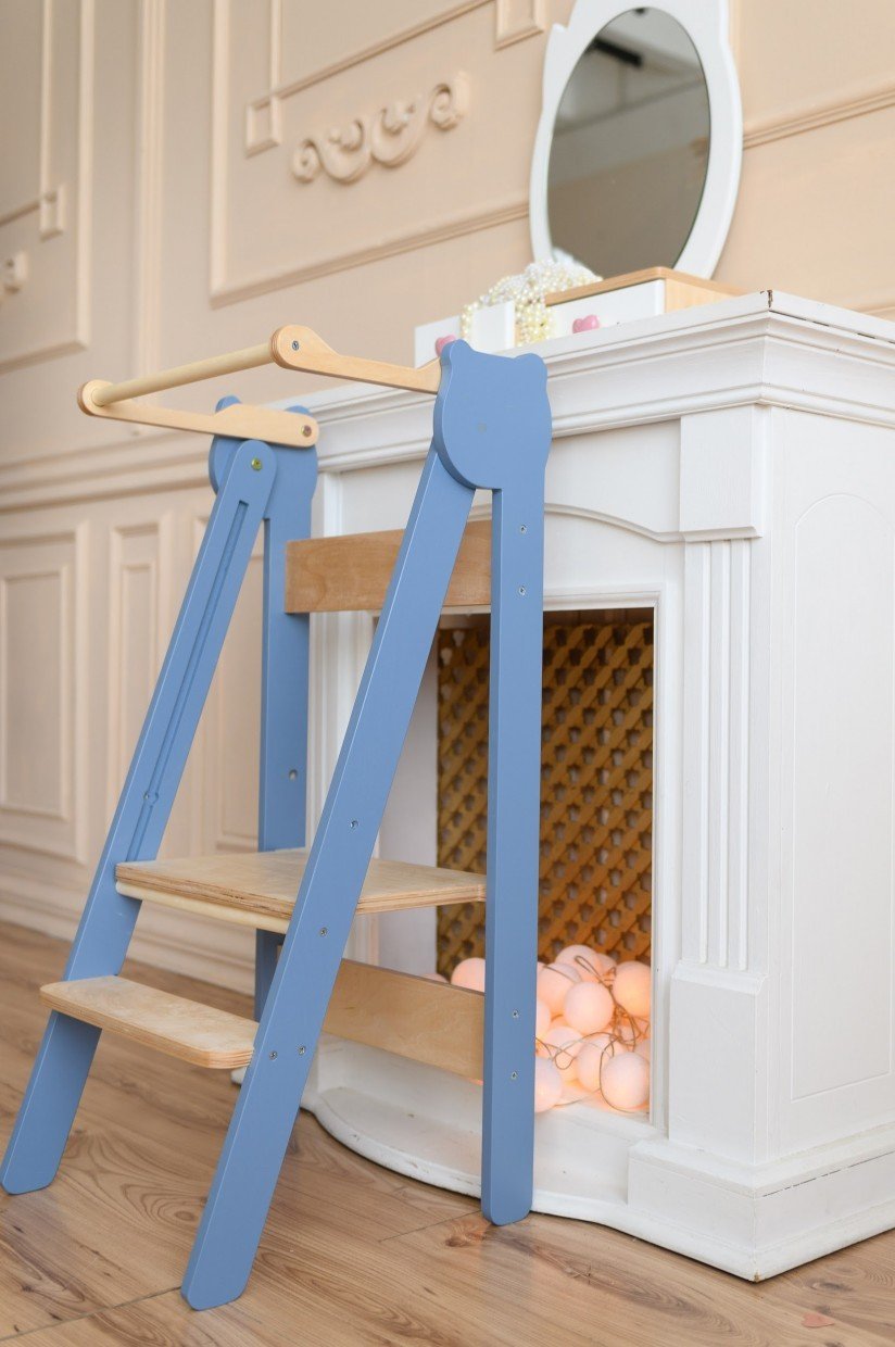 19. Blue step stool against white vanity in elegant room