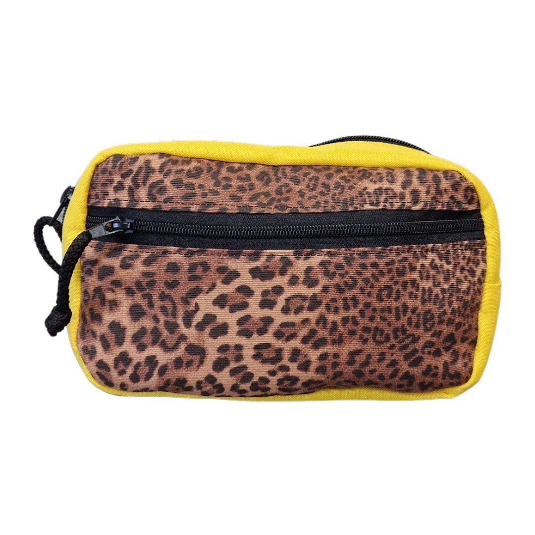2. Close-up of leopard print front pocket on yellow waist bag with black zipper