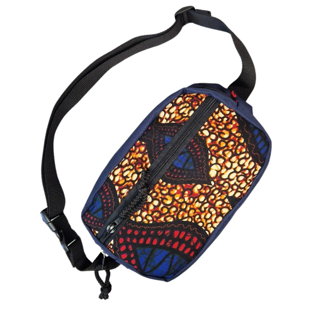 3. Close-up of Drinbags waist bag showing colorful pattern and black strap from side angle