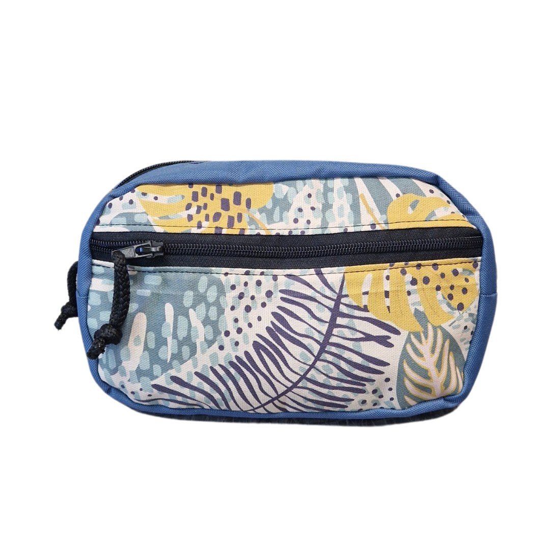 2. Studio shot of Drinbags spacious water-resistant waist bag in blue with tropical print, front view