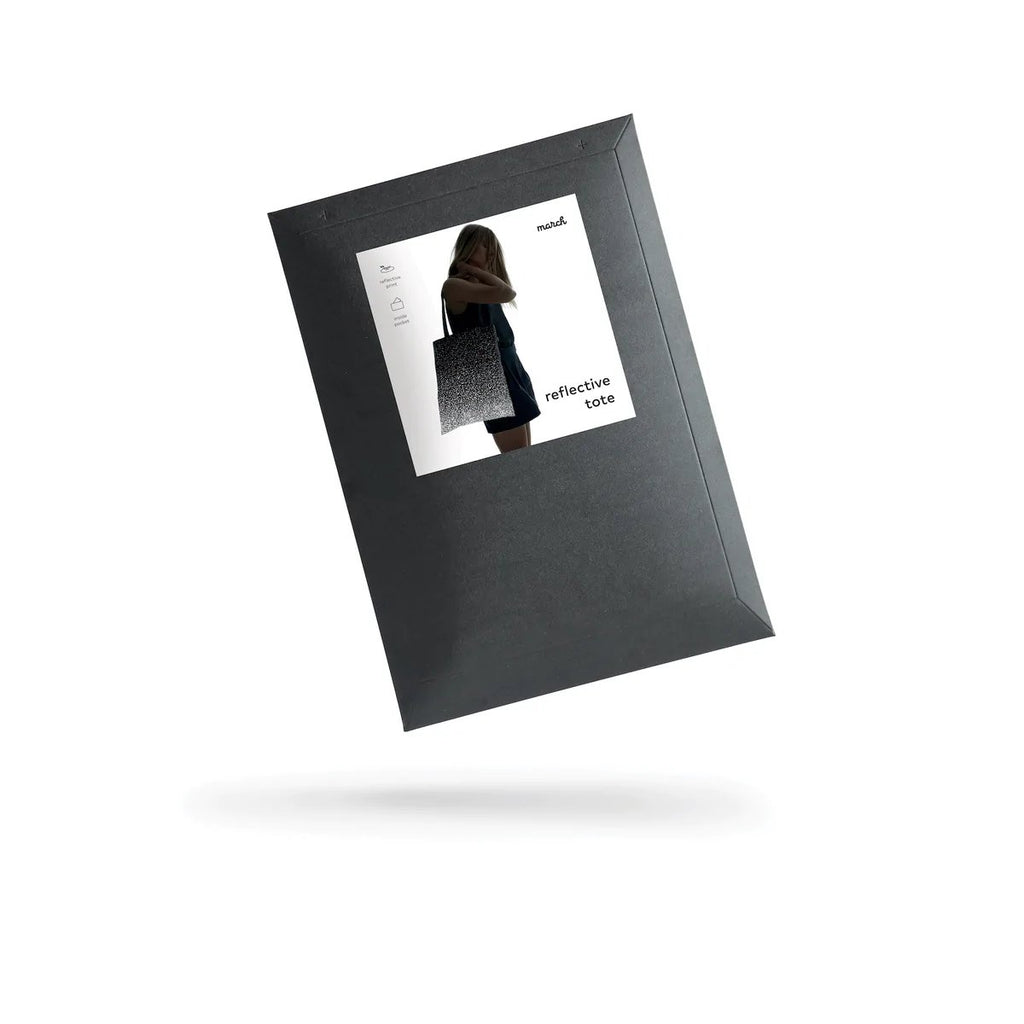 3. Black cardboard envelope packaging for MARCH Reflective Tote SPLASH with product image
