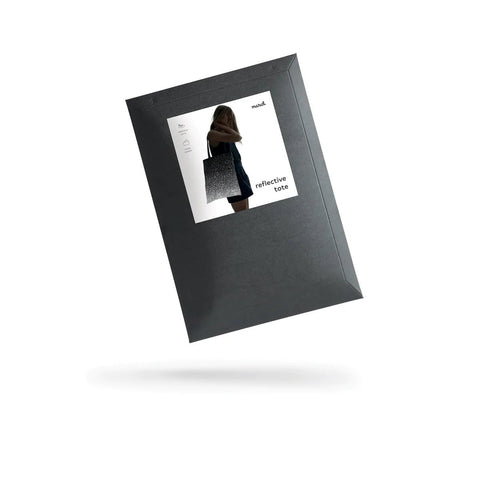 3. Black cardboard envelope packaging for MARCH Reflective Tote SPLASH with product image