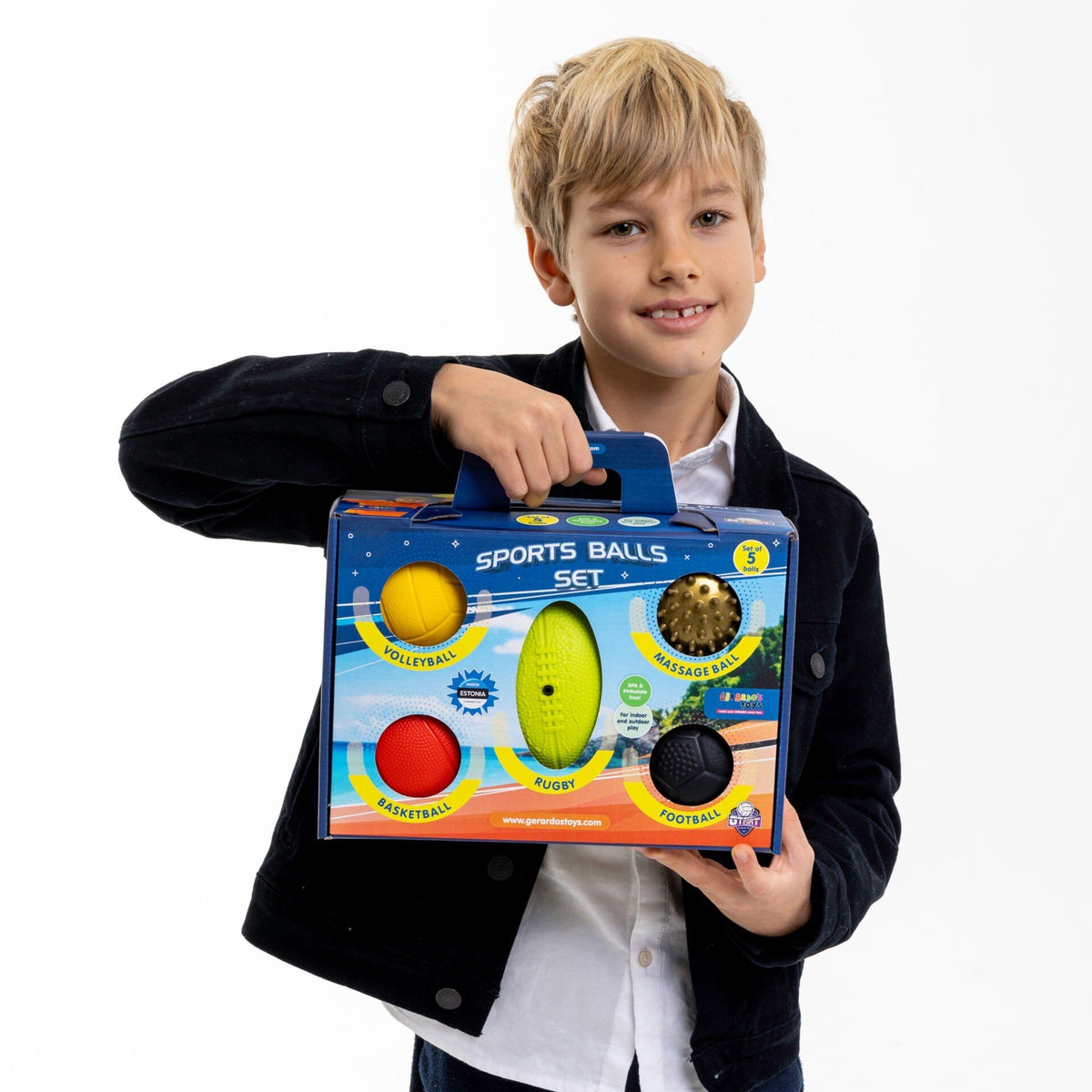 1. Boy holding Gerardo's Toys sports balls set in packaging against white background
