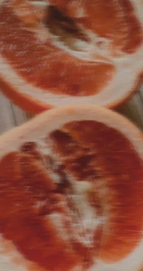 2. Close-up of sliced grapefruit showcasing vibrant red and orange hues