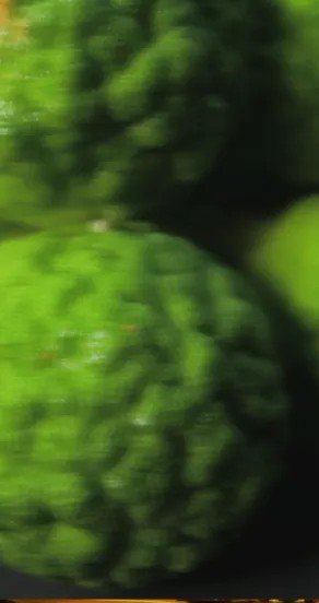 3. Close-up of green bergamot fruit with textured skin