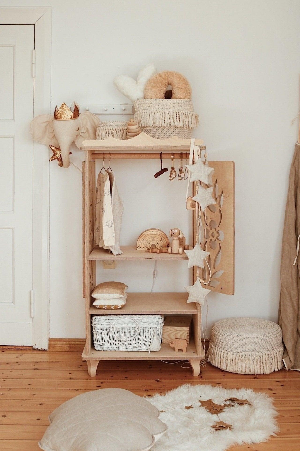 6. Linen star garland with wooden beads decorating wooden shelf in cozy room