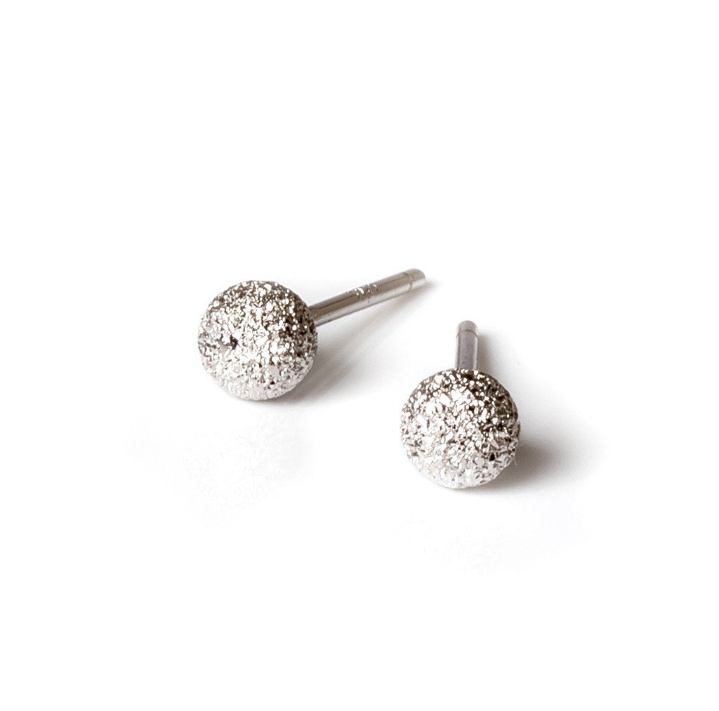 2. MyaMoon Stardust Ball Earrings in silver, featuring 4mm diameter and elegant textured design, studio shot