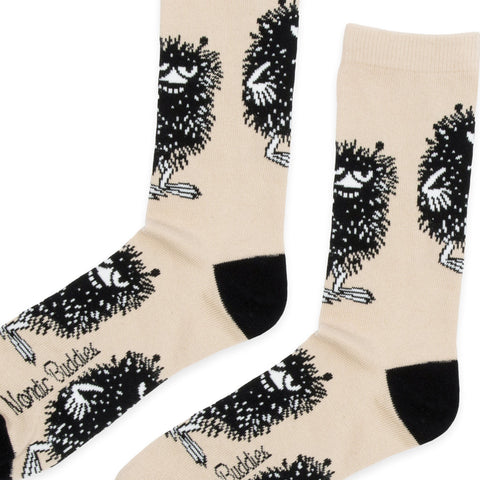 2. Close-up of men's beige Moomin Stinky Plotting socks by NordicBuddies, highlighting detailed design and black toe